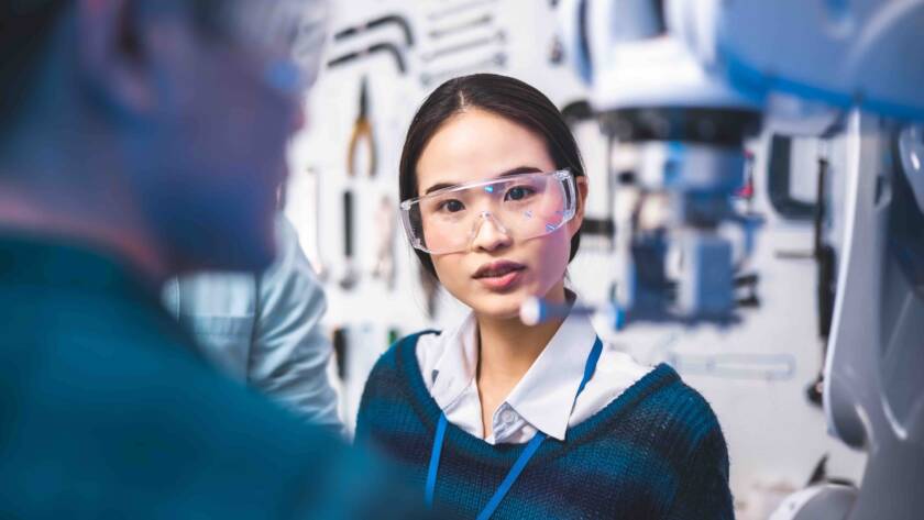 woman in lab talking to colleague