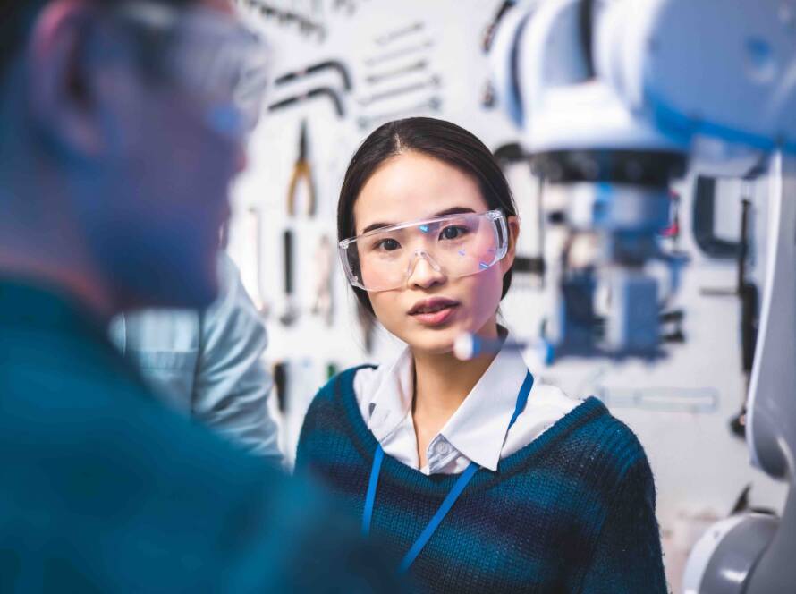 woman in lab talking to colleague