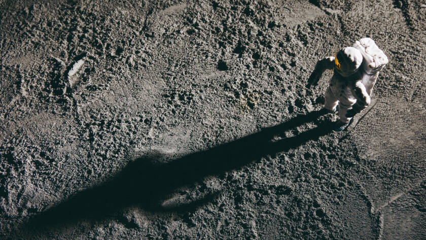 An astronaut on the surface of the moon.