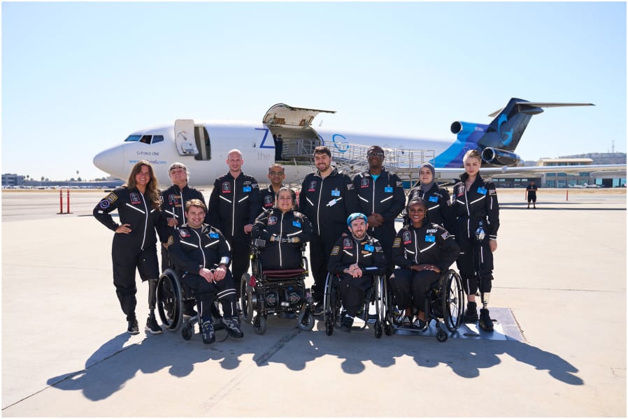 AstroAccess Ambassadors smiling in front of the Zero-G plane.